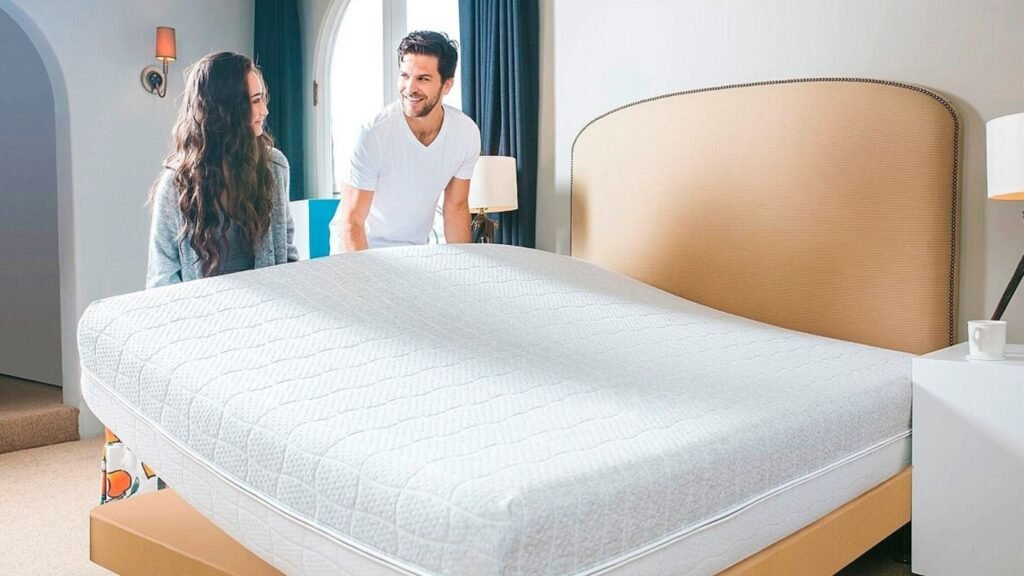 A couple moving a room mattress and other nighttime comfort items for a good sleep