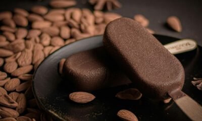 Oreo and coffee ice cream flavors in a plate alongwith almonds