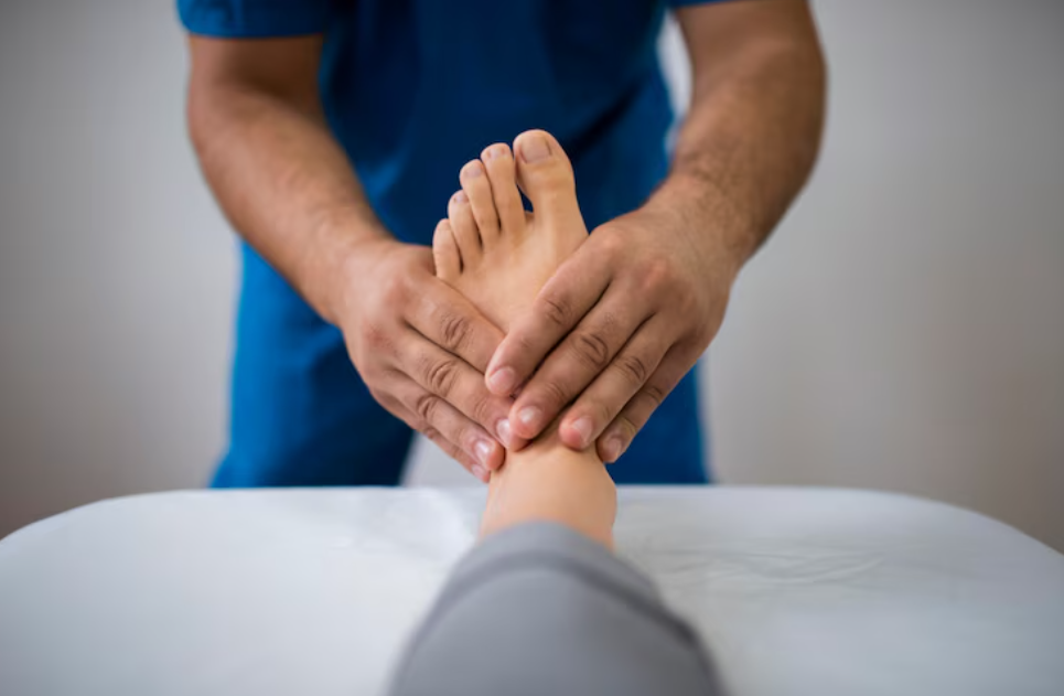 Doctor giving treatment of plantar fasciitis