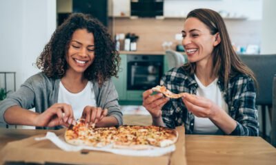 Two attractive women having fun with healthy food Takeaway Stockport