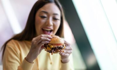 The Girl is eating Juiciest Burgers at home